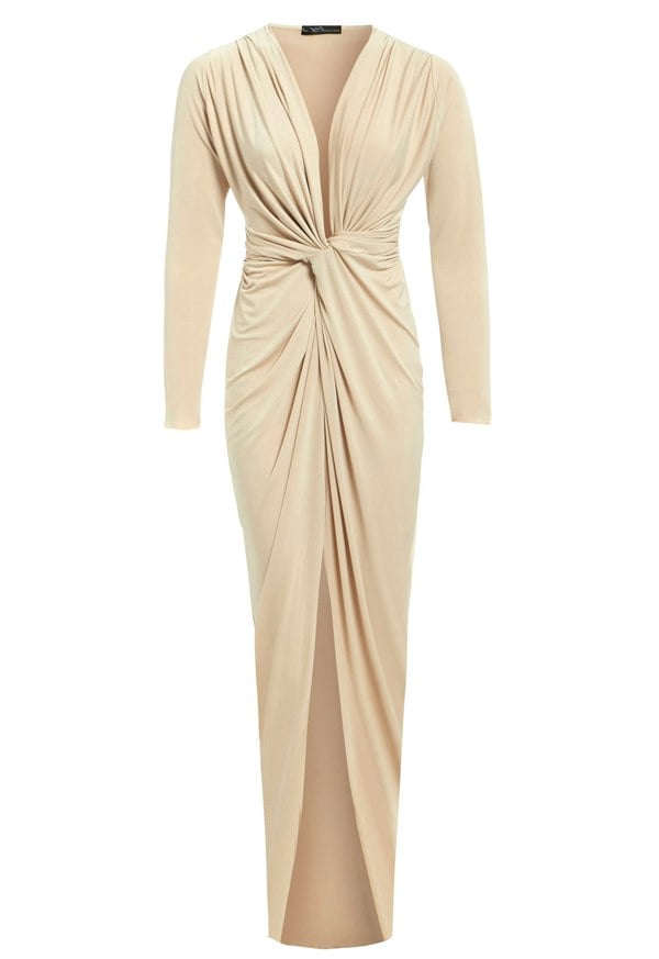 a beige long sleeved Sarvin dress with a slit.