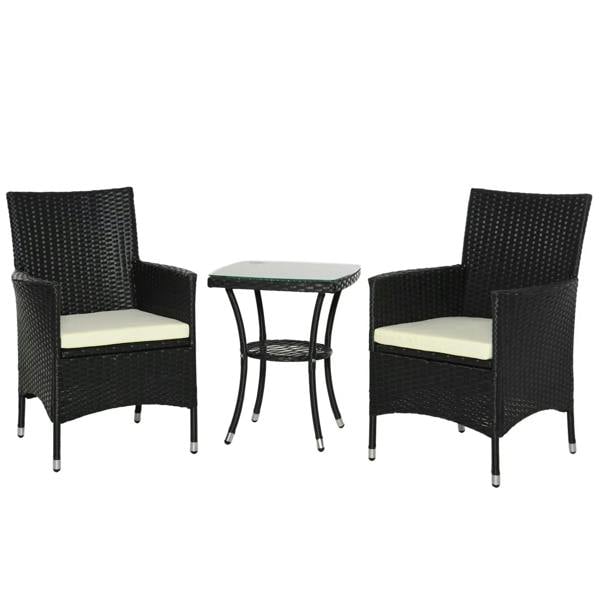 Black rattan bistro set with two armchairs, cream cushions, and glass-top side table