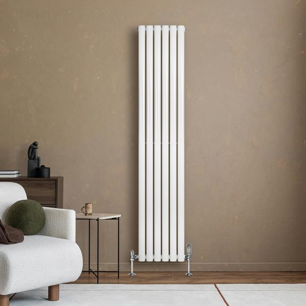 Sleek white oval single column radiator with vertical bars, mounted on a wall, complemented by modern decor and furniture