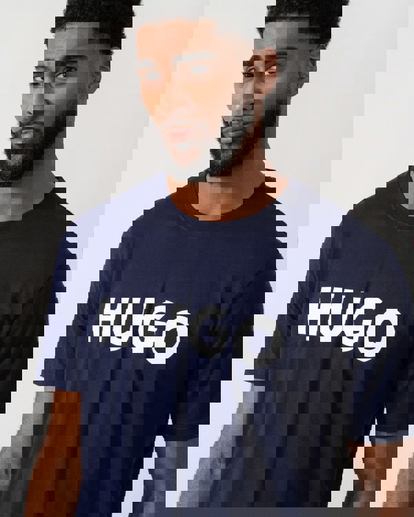 close up of a Model wearing a HUGO Dulivio Mens T-Shirt in Navy
