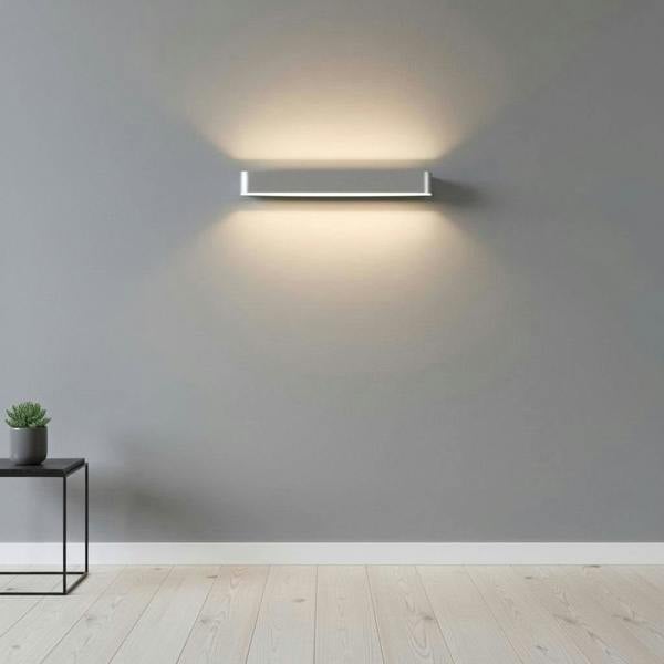 Silver up and down interior wall sconce able to light many areas of the house