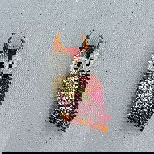 Owl brooch, gold tone metal, encrusted with pink, yellow and red crystals, large white enamel eyes with black detail, perched on branch design, sparkling statement jewellery, vintage inspired animal accessory, unique gift for her
