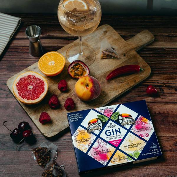 Natural & Noble Gin Infusion Bags,  Alongside a Glass of Infused Gin and Fresh Fruit