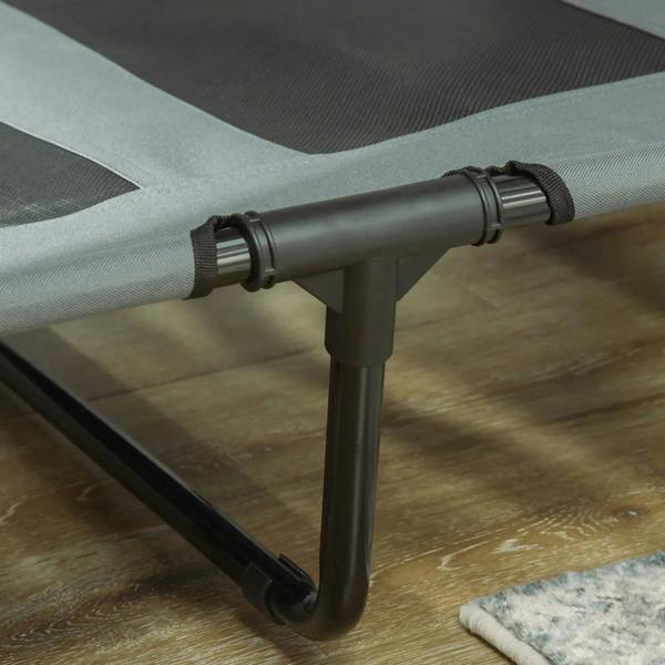 Close-up of grey bed frame legs with protective foot pads and strap connector