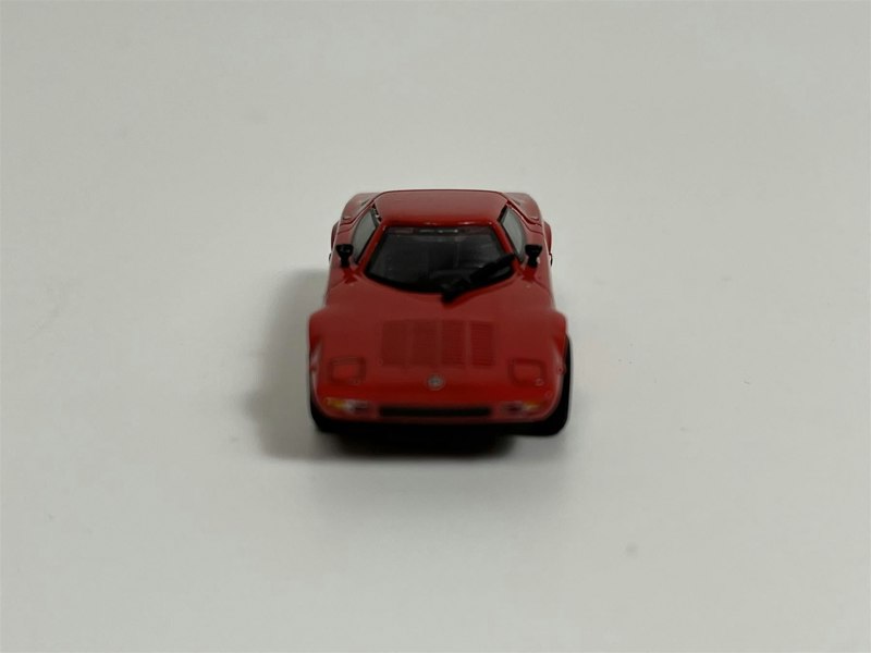 a red toy car on a white background