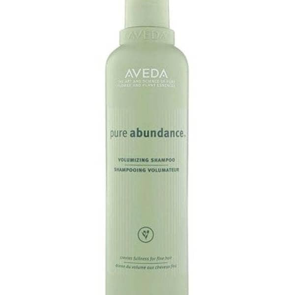 Aveda pure abundance volumizing shampoo bottle on a white background
