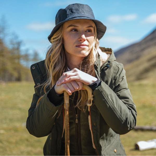 Women wearing the Hoggs of FIfe Ladies Walker long coat out on the field