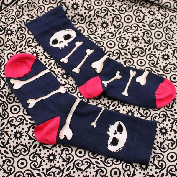Navy bamboo crew socks with skull-and-bones design and red toe and cuff accents.