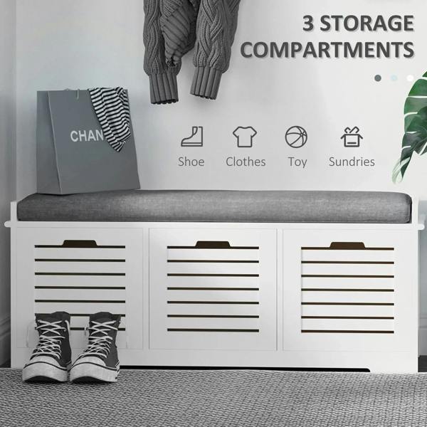 White shoe storage bench with gray cushion and three slatted drawer compartments
