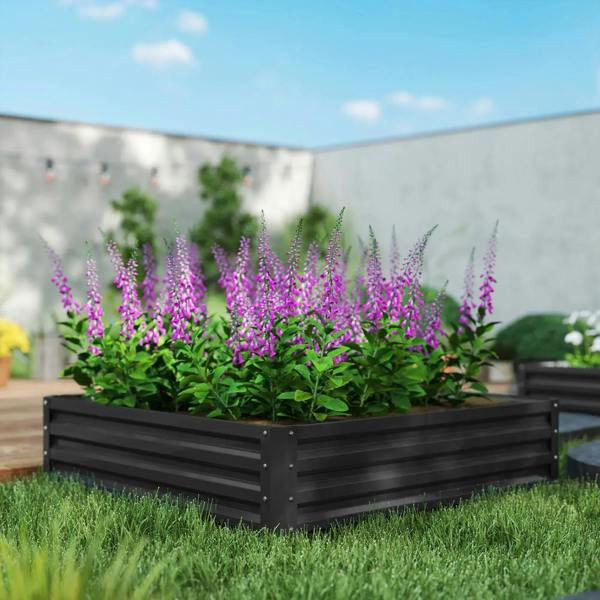Square raised garden bed with dark grey metal frame, planted with purple flowers