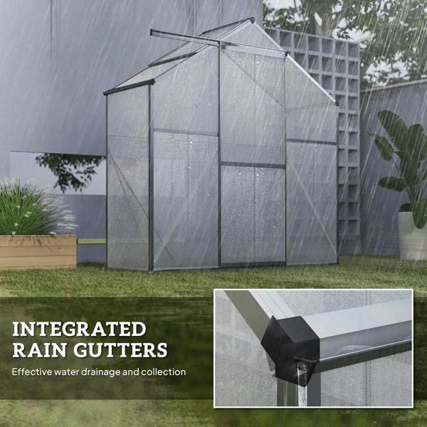 Polycarbonate greenhouse with integrated dark grey rain gutters along the roof edge
