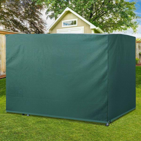 Dark green outdoor patio swing bench cover fully covering a swing bench on grass