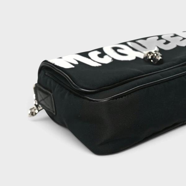 Supplied Fashion black nylon crossbody bag with white graffiti skull motif and adjustable shoulder strap