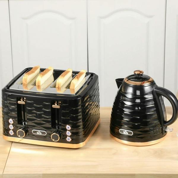 Black kettle and 4-slice toaster on wooden counter with kettle spout and base visible