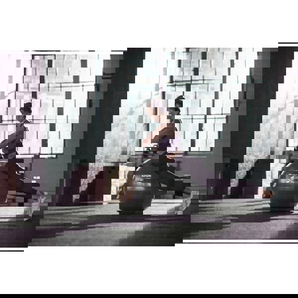 Woman using Reebok 75cm Gym Ball