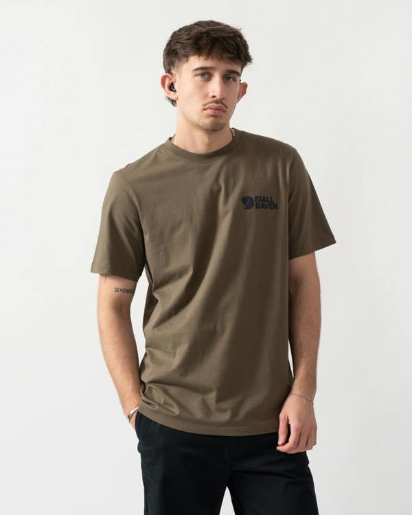 studio shot of a model wearing a Fjallraven Swedish Forest Mens T-Shirt in Laurel Green 625