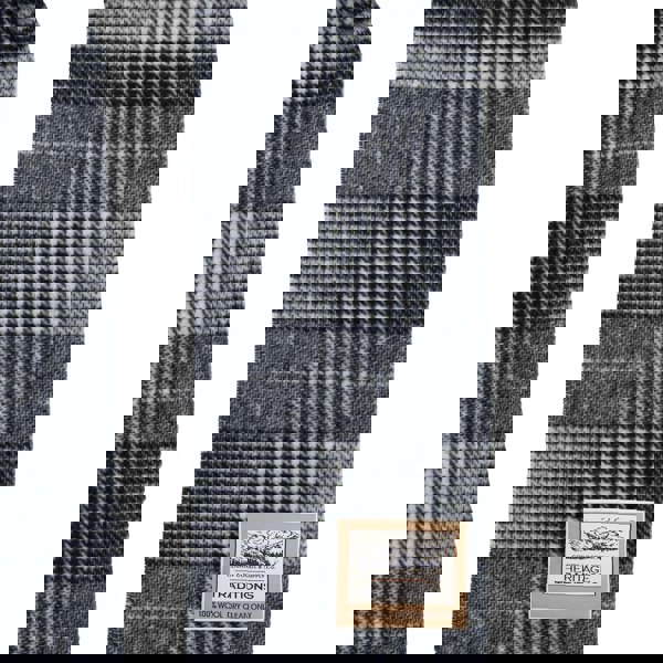 Plaid scarf with a label on a white background