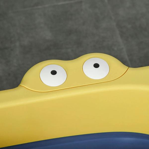 Yellow baby bathtub front with cartoon eyes and blue inner basin