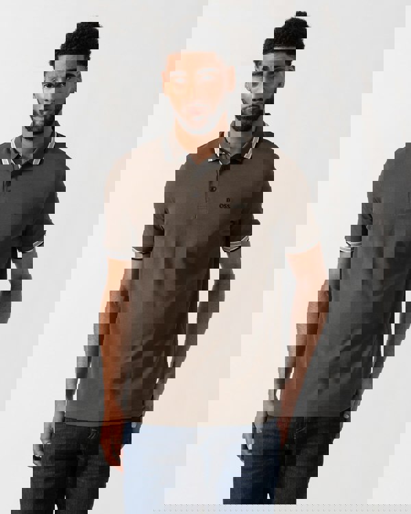 Model wearing BOSS Green Mens Paddy Cotton-Piqué Polo Shirt with Contrast Logo in Open Beige 297 - main