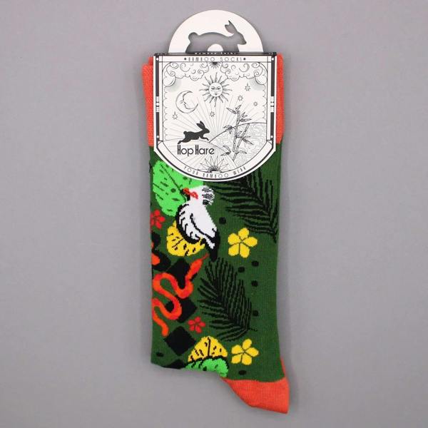 Single jungle print bamboo sock on card: green with white leopard and orange accents