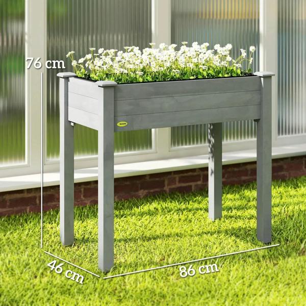 Dark grey raised planter box holding white flowers, with tall leg supports.