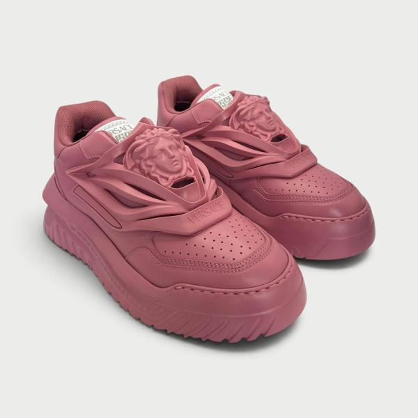 Supplied Fashion Versace Odissea sneakers in jam red featuring a prominent Medusa head motif and chunky rubber sole.