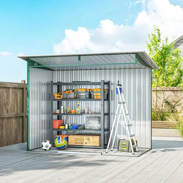 Green metal shed interior with wall shelves, tools, and open double doors