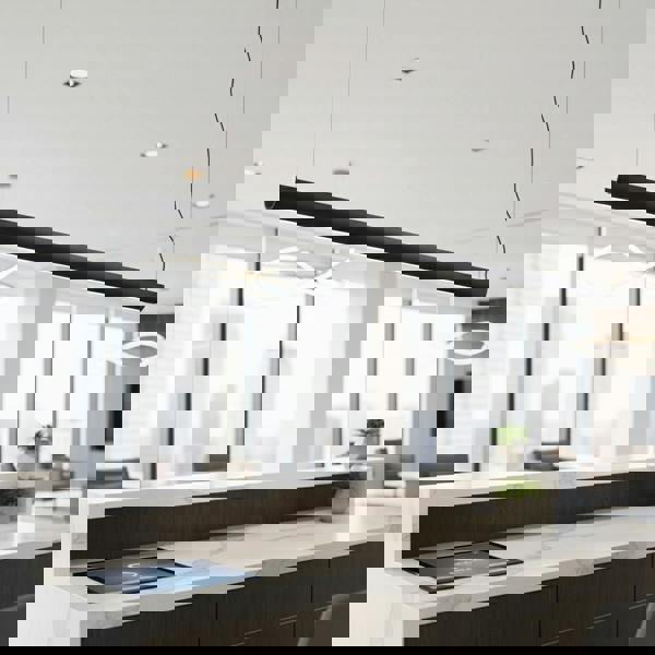 black linear pendant light installed over a reception desk