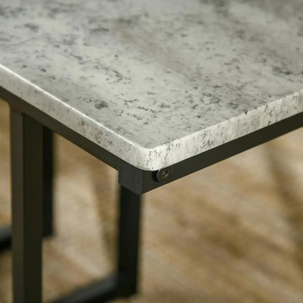 Corner detail of grey concrete-effect tabletop with black steel leg and fastener