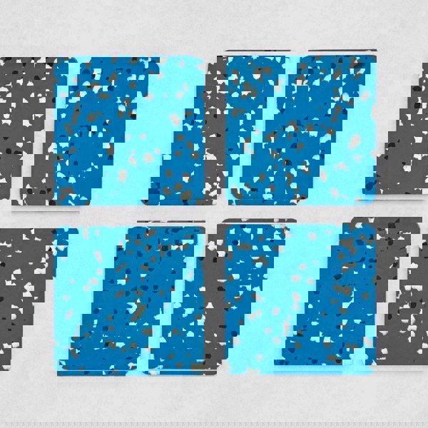set of 4 recycled plastic blue square coasters made with black and white speckles.