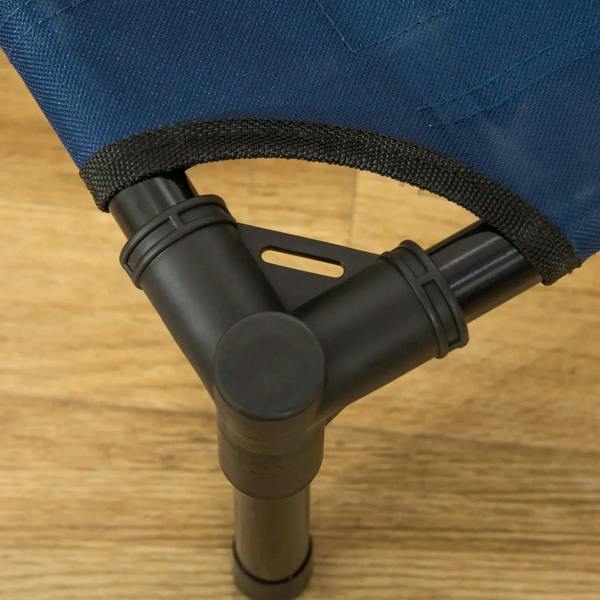Black anti-slip foot and strap connector on a blue elevated pet cot