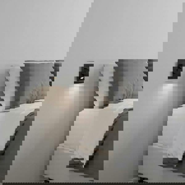 black recessed LED reading lamp for bed recessed into the wall next to a bed in a modern bedroom