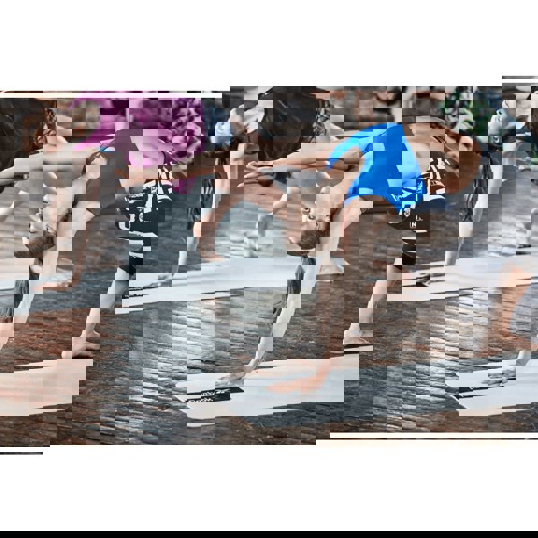 Yoga class using the Reebok Studio Yoga Mat - Grey