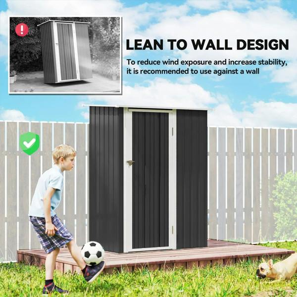 Grey outdoor storage shed with sloped roof and front door, set on a raised base