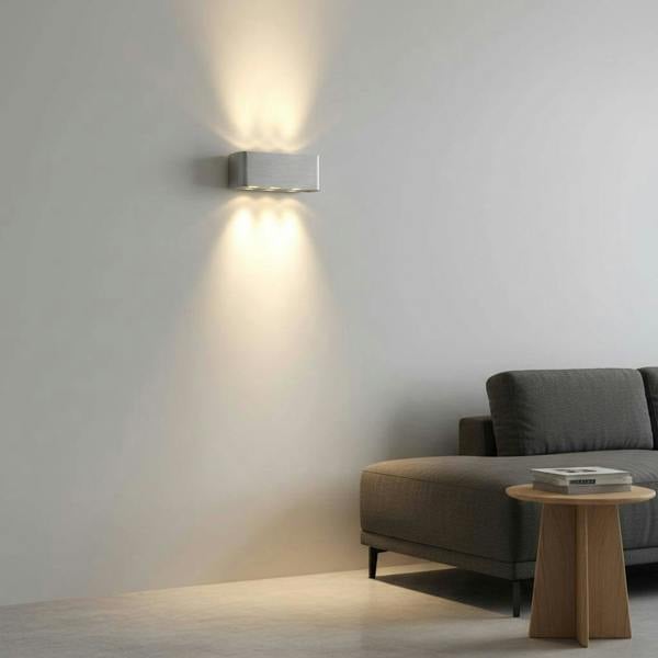 Silver internal wall light up and down lighting on a grey wall in a modern house