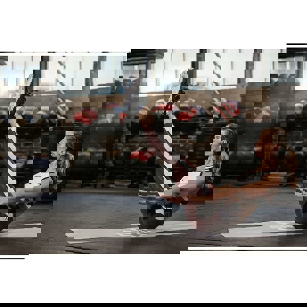 Woman in exercise class using a Reebok Love Fitness Mat - Grey