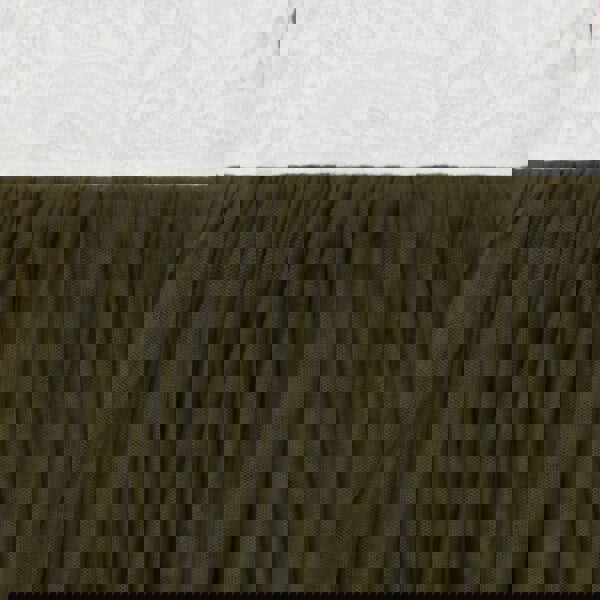 Close-up of olive green fabric against a textured white background