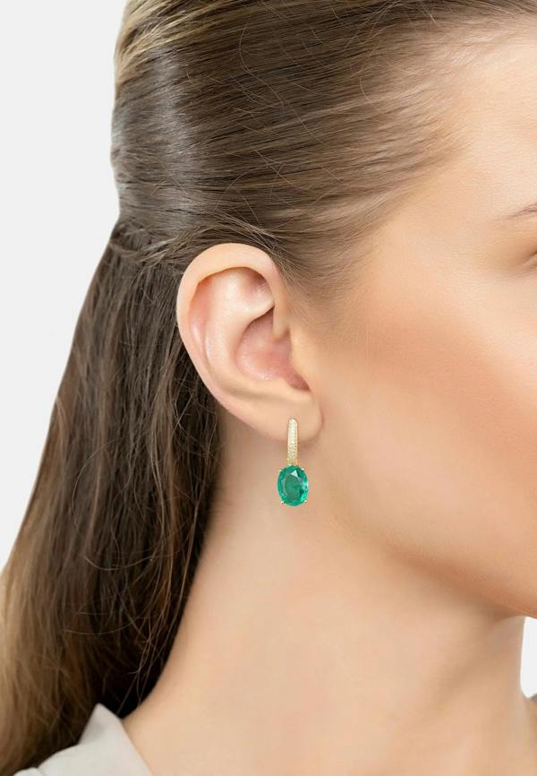 The earring worn by a model.