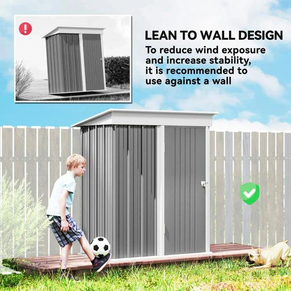 Grey metal lean-to shed with door, designed to lean against a wall for stability