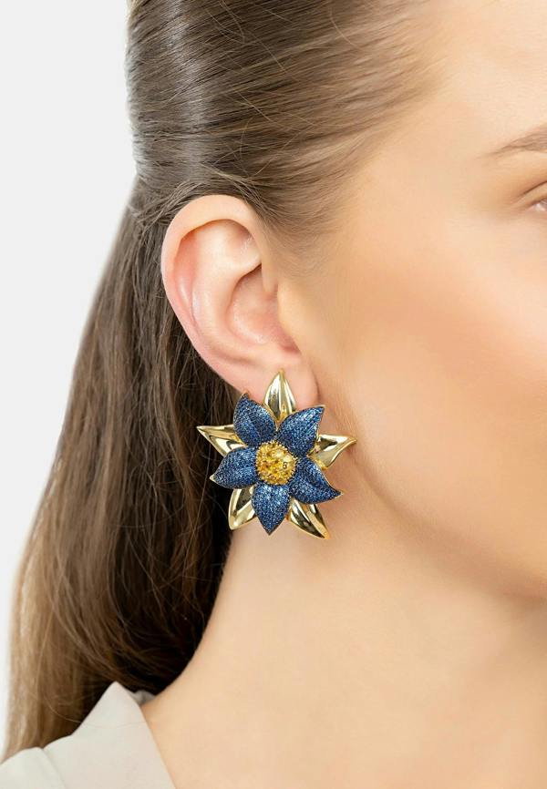 The earring worn by a model.