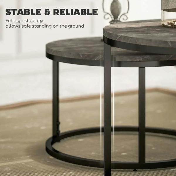 Round nesting coffee table with dark marbled top and sturdy black steel base frame