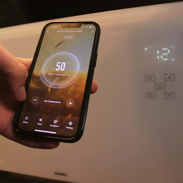 A phone in front of the heater showing the App