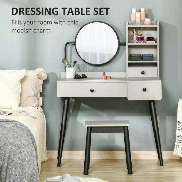 Gray vanity dressing table set with round mirror and three drawers plus stool.