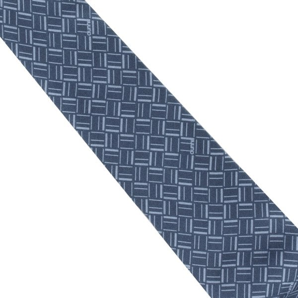 Dunhill silk tie featuring an abstract longtail print inspired by the exaggerated typography of the iconic dunhill logo.