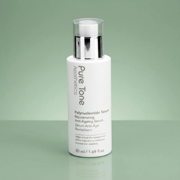 Pure Tone Aesthetics x Kimberley Walsh Polynucleotide Serum in a white cylindrical bottle with a silver pump and clear cap, set against a soft green gradient background.