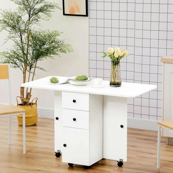 White drop-leaf dining table with drawers and cabinet storage, front corner view.