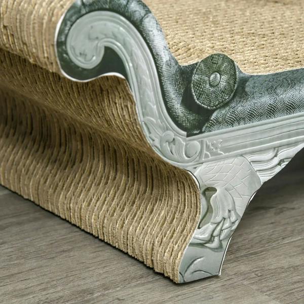 Close-up corner of brown cardboard cat scratching lounger with textured base and trim