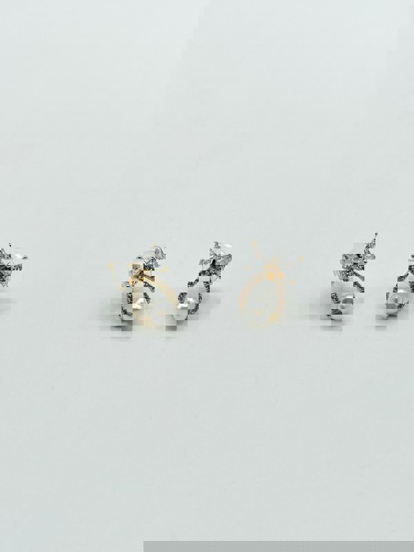 SVNX Studded Bow Earrings with Hanging Pearl in Gold Colour