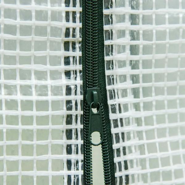 Close-up of greenhouse mesh with zipper track and pull tab on steel frame