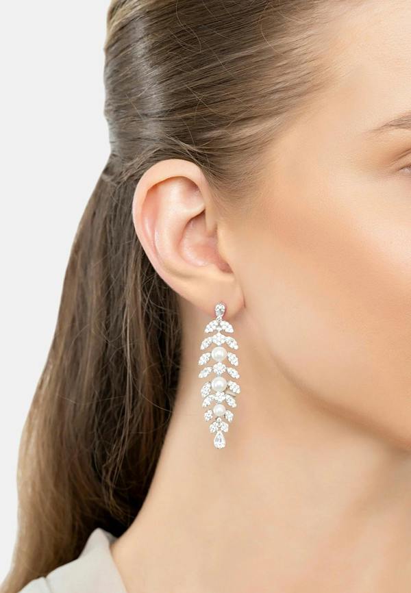 The earring worn by a model.